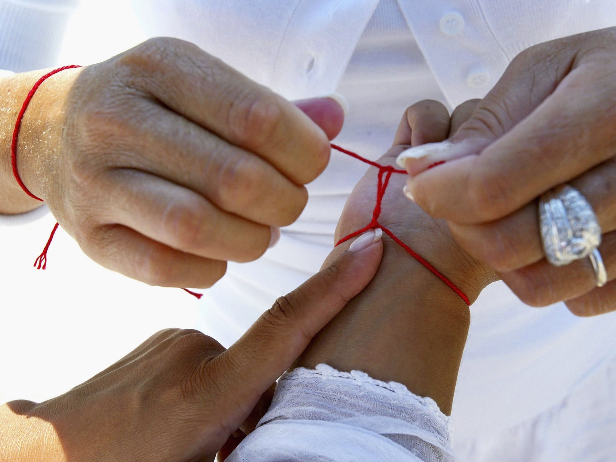 Red on sale bracelet meaning